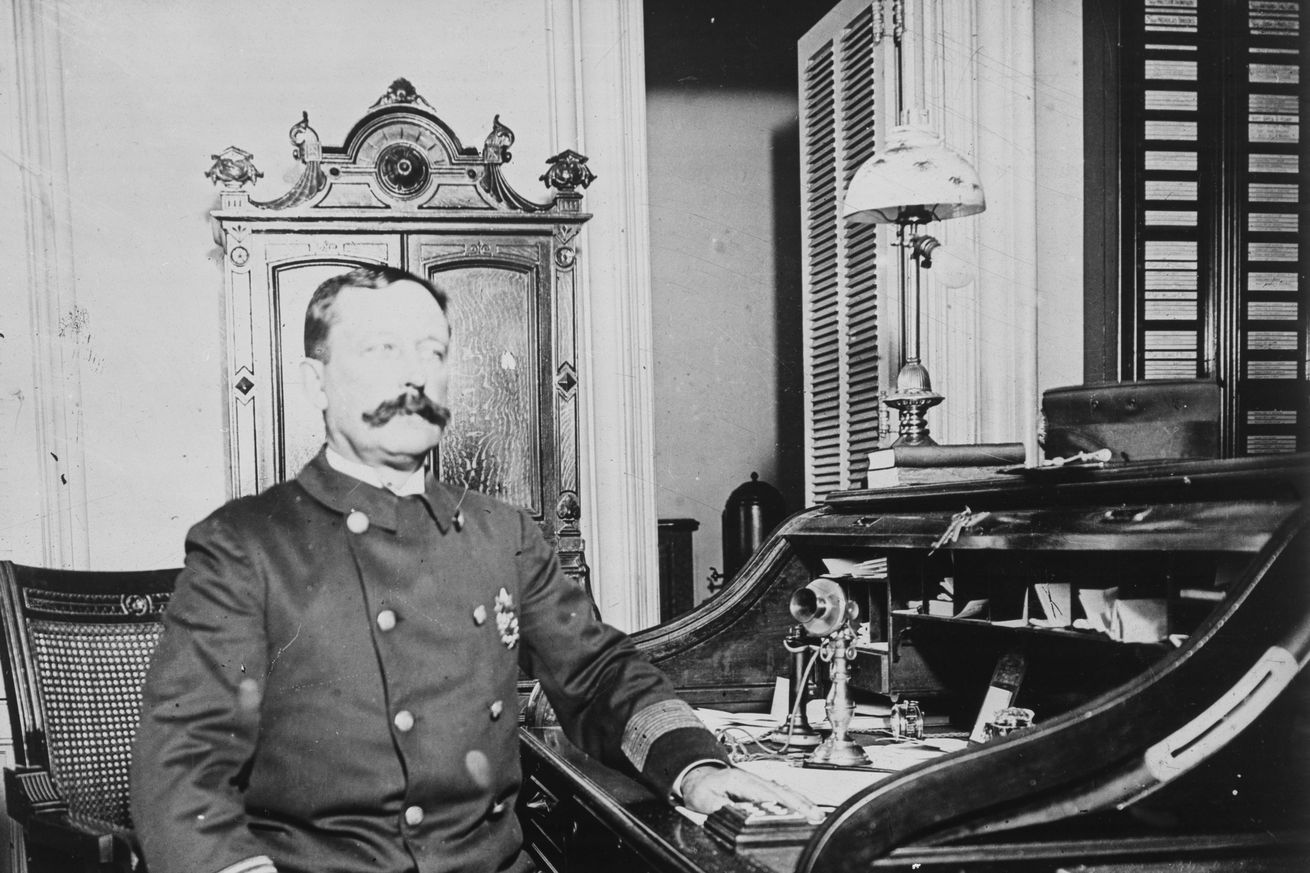 New York Police Captain Sitting at Desk