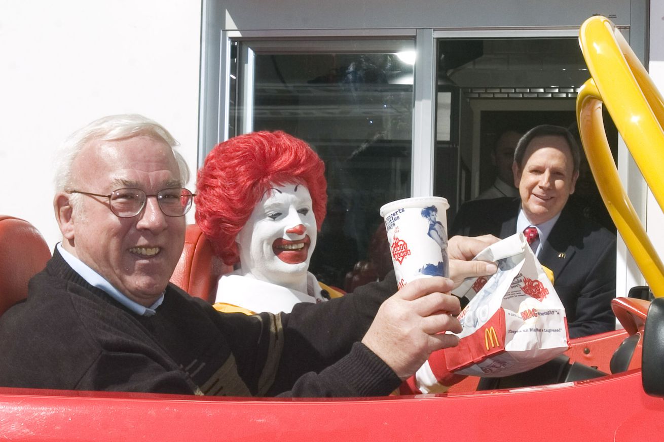 McDonald’s CEO Jim Skinner, right, waits to serve McDonald’s