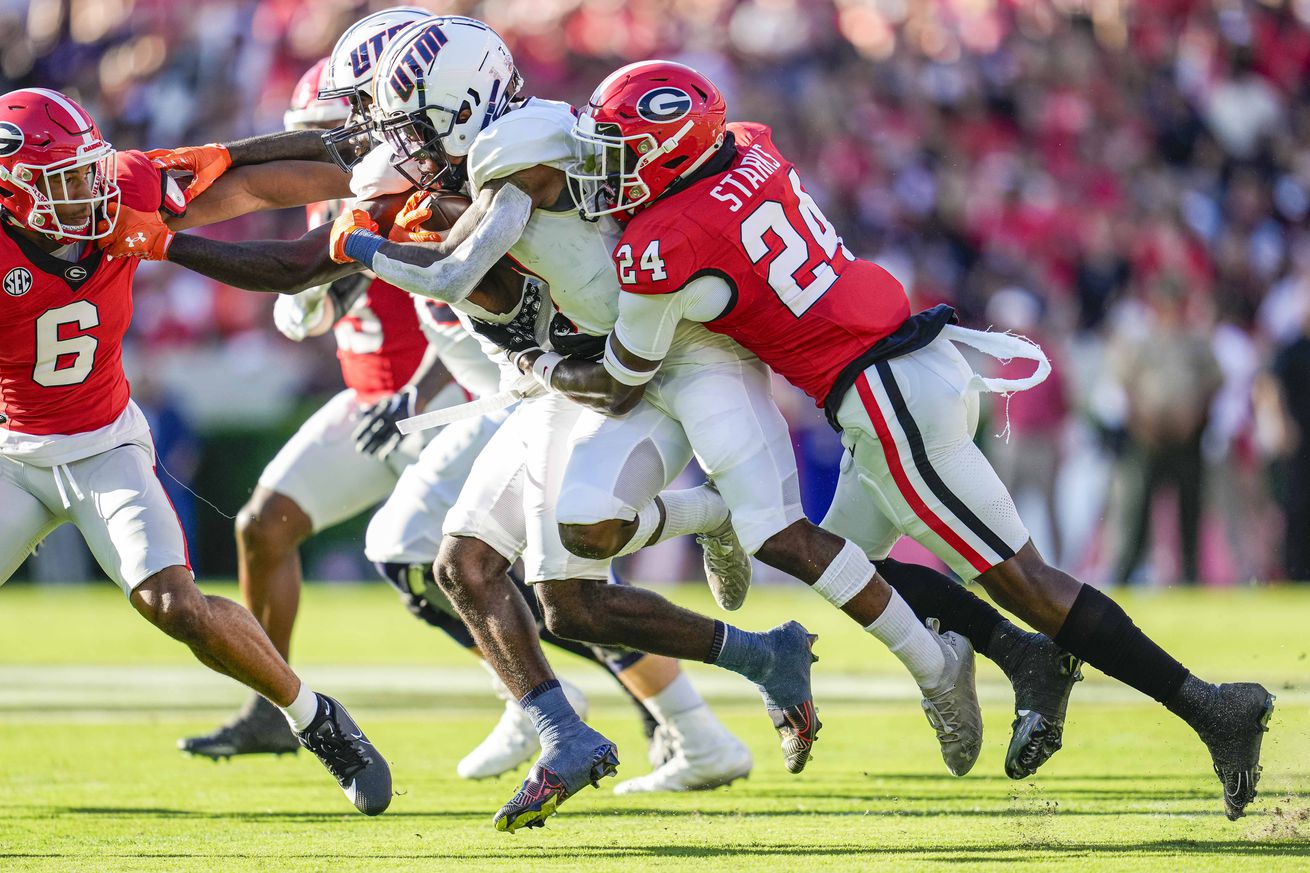 Sep 2, 2023; Athens, Georgia, USA; Tennessee Martin Skyhawks running back Narkel Leflore (7) is tackled by Georgia Bulldogs defensive back Malaki Starks (24) during the first quarter at Sanford Stadium.