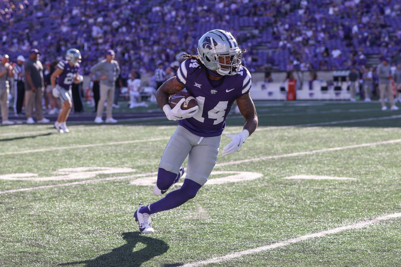 MANHATTAN, KS - AUGUST 31: Kansas State Wildcats wide receiver Dante Cephas (14) runs with the ball before a college football game between the UT Martin Skyhawks and Kansas State Wildcats on August 31, 2024 at Memorial Stadium in Columbia, MO.