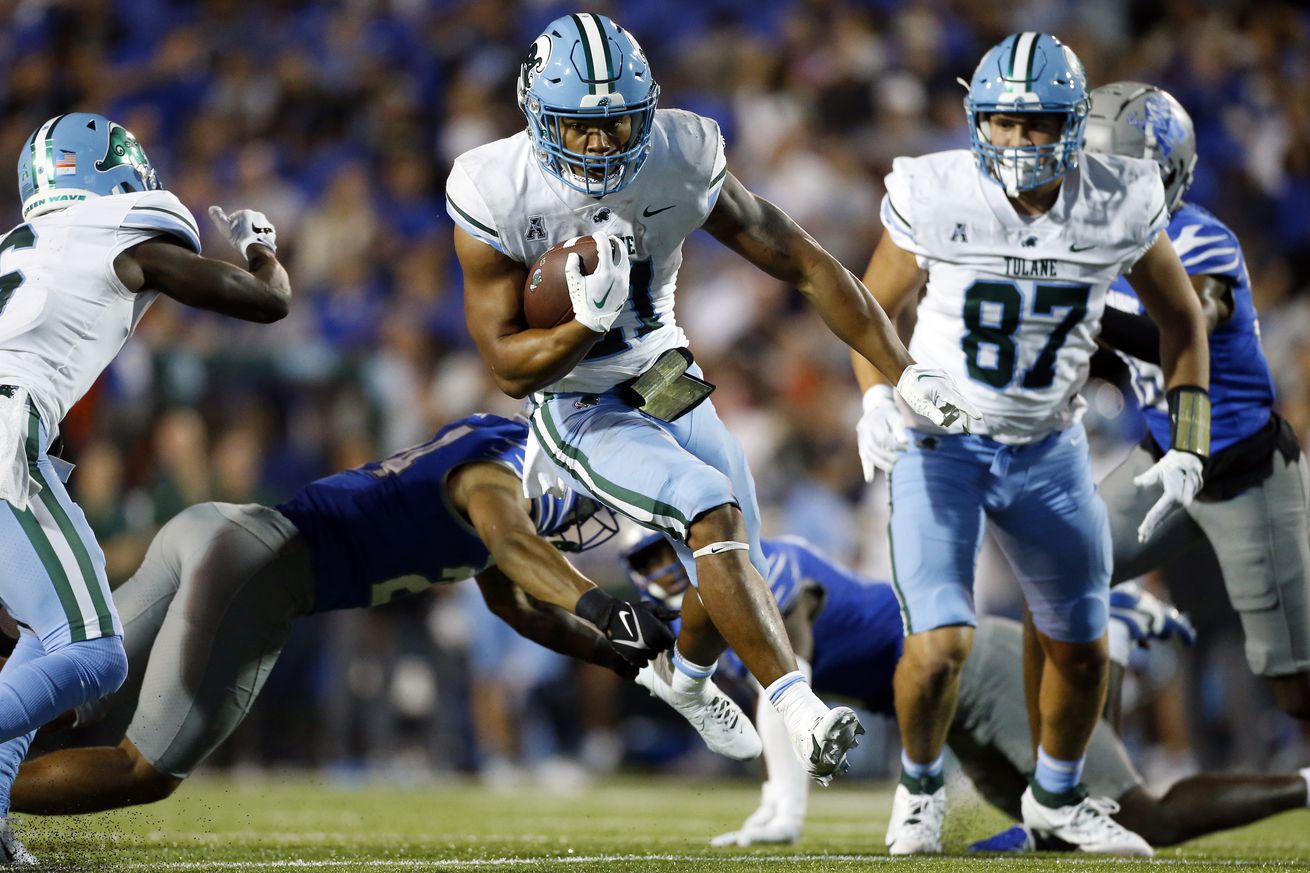 Oct 13, 2023; Memphis, Tennessee, USA; Tulane Green Wave running back Makhi Hughes (21) runs the ball during the second half against the Memphis Tigers at Simmons Bank Liberty Stadium