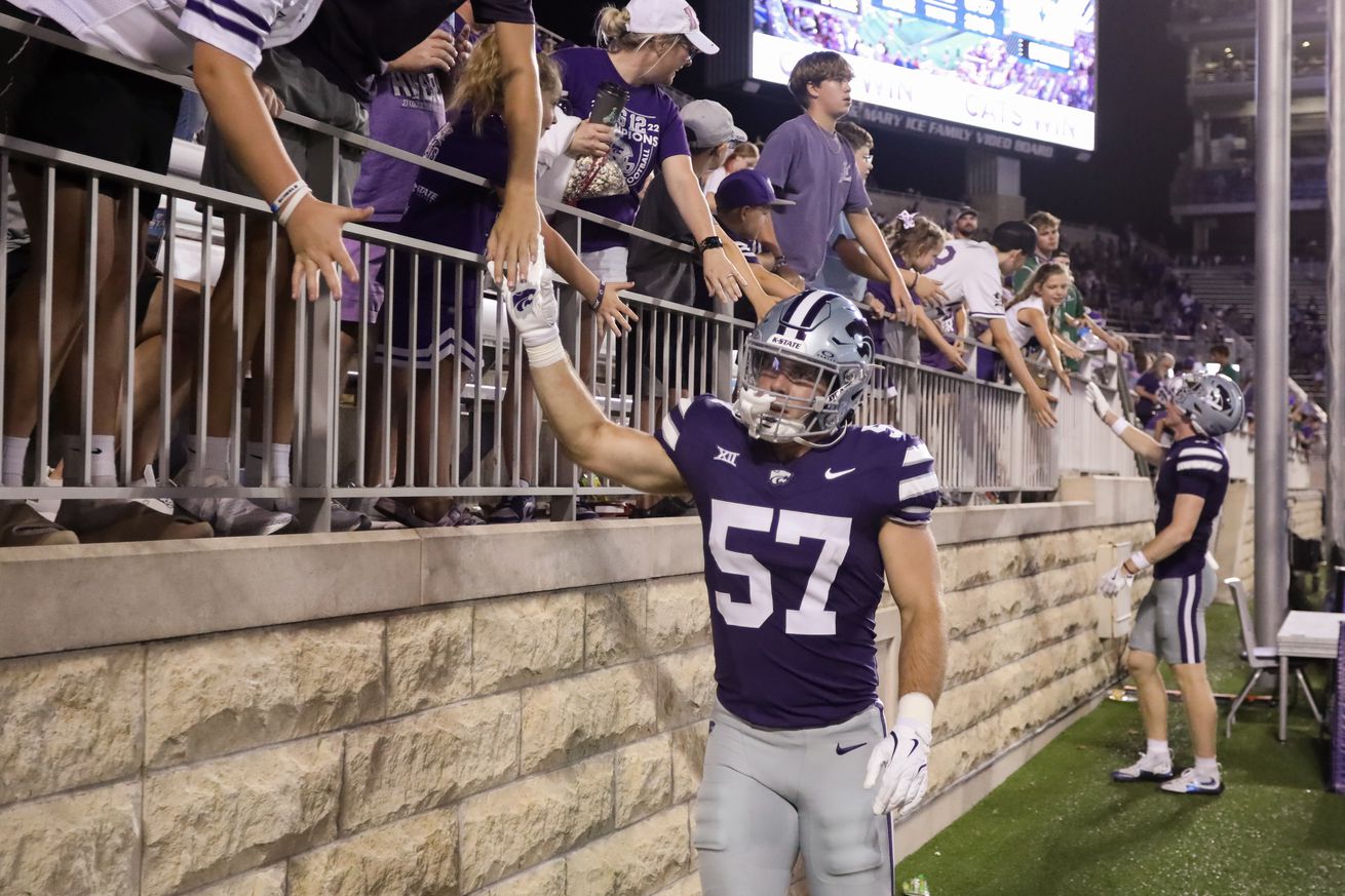 MANHATTAN, KS - AUGUST 31: Kansas State Wildcats linebacker Beau Palmer (57) shakes hands with fans after a college football game between the UT Martin Skyhawks and Kansas State Wildcats on August 31, 2024 at Memorial Stadium in Columbia, MO.