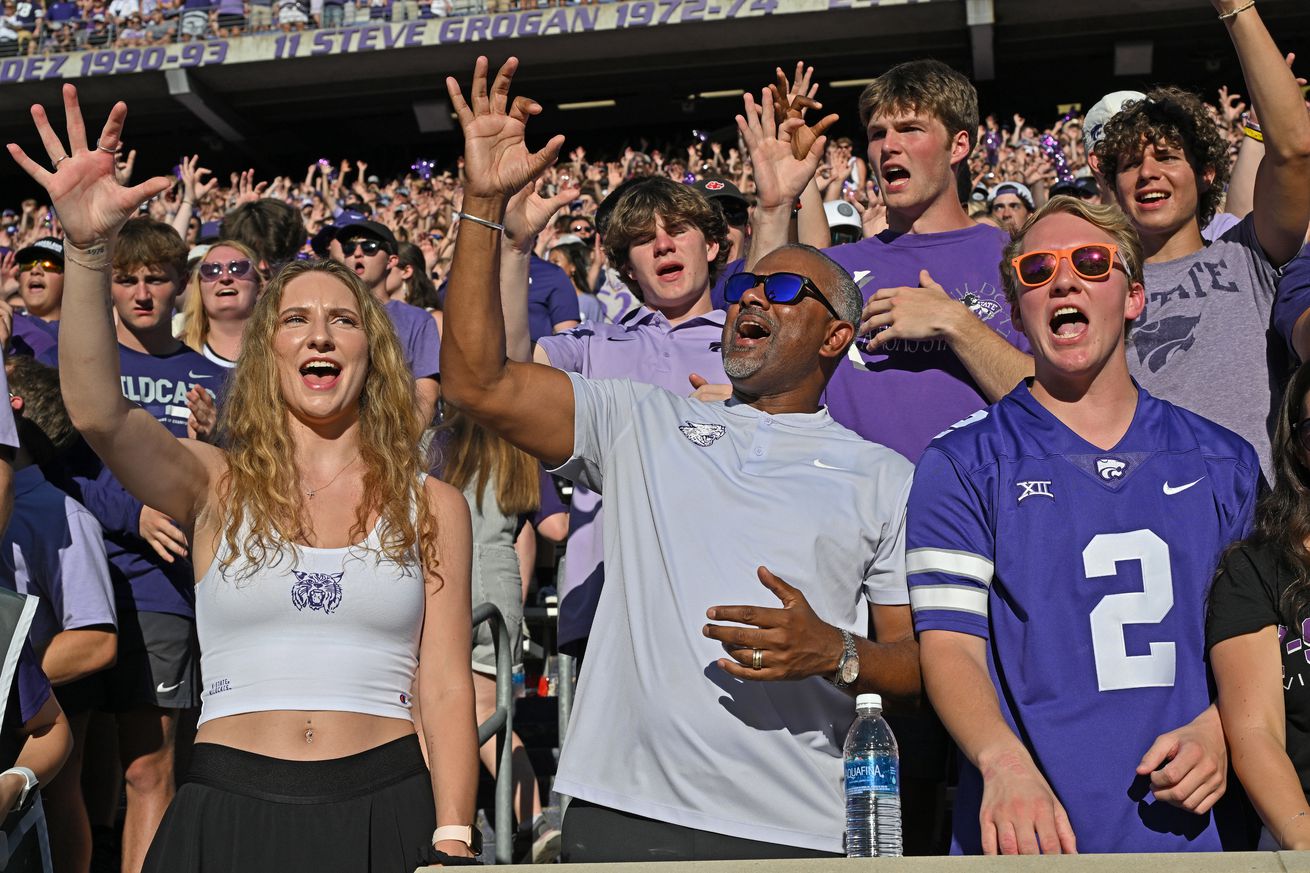 Kansas State Wildcats Men’s Basketball coach Jerome Tang (C) cheers with students before a game between the Kansas State Wildcats and Tennessee Martin Skyhawks at Bill Snyder Family Football Stadium on August 31, 2024 in Manhattan, Kansas.