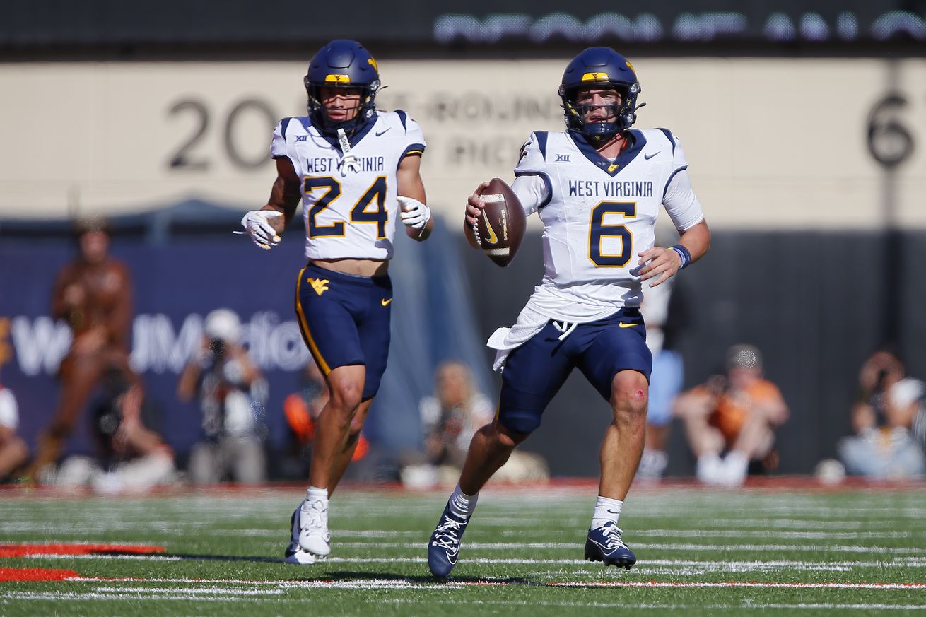 STILLWATER, OK - OCTOBER 5: Quarterback Garrett Greene #6 of the West Virginia Mountaineers scrambles up the middle for a six-yard gain against the Oklahoma State Cowboys in the second quarter at Boone Pickens Stadium on October 5, 2024 in Stillwater, Oklahoma. West Virginia won 38-14.