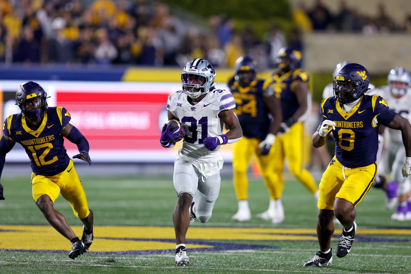 Kansas State Wildcats running back DJ Giddens (31) runs with the football during the third quarter of the college football game between the Kansas State Wildcats and the West Virginia Mountaineers on October 19, 2024, at Mountaineer Field at Milan Puskar Stadium in Morgantown, WV.