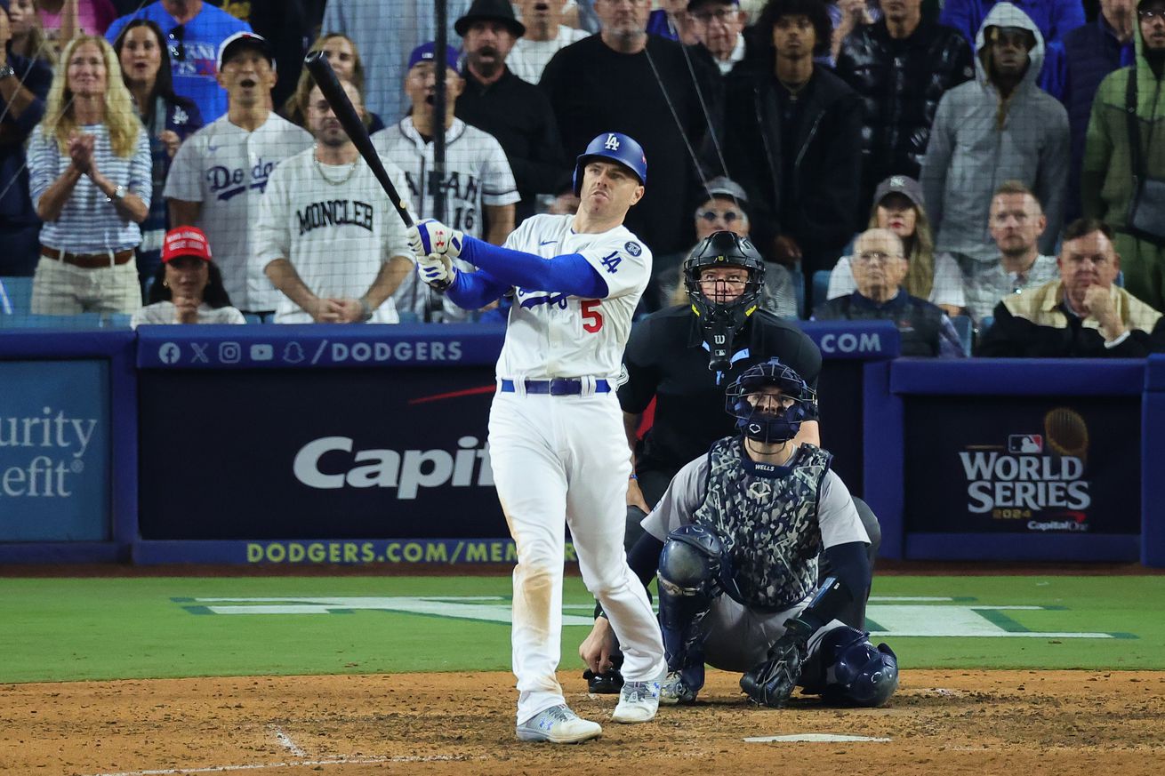 Freddie Freeman #5 of the Los Angeles Dodgers hits a walk-off grand slam during the tenth inning against the New York Yankees during Game One of the 2024 World Series