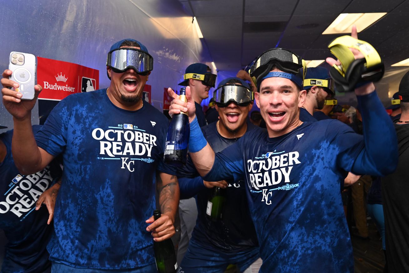 Kansas City Royals players celebrate in the locker room after defeating the Baltimore Orioles in game two of the Wild Card round for the 2024 MLB Playoffs at Oriole Park at Camden Yards.