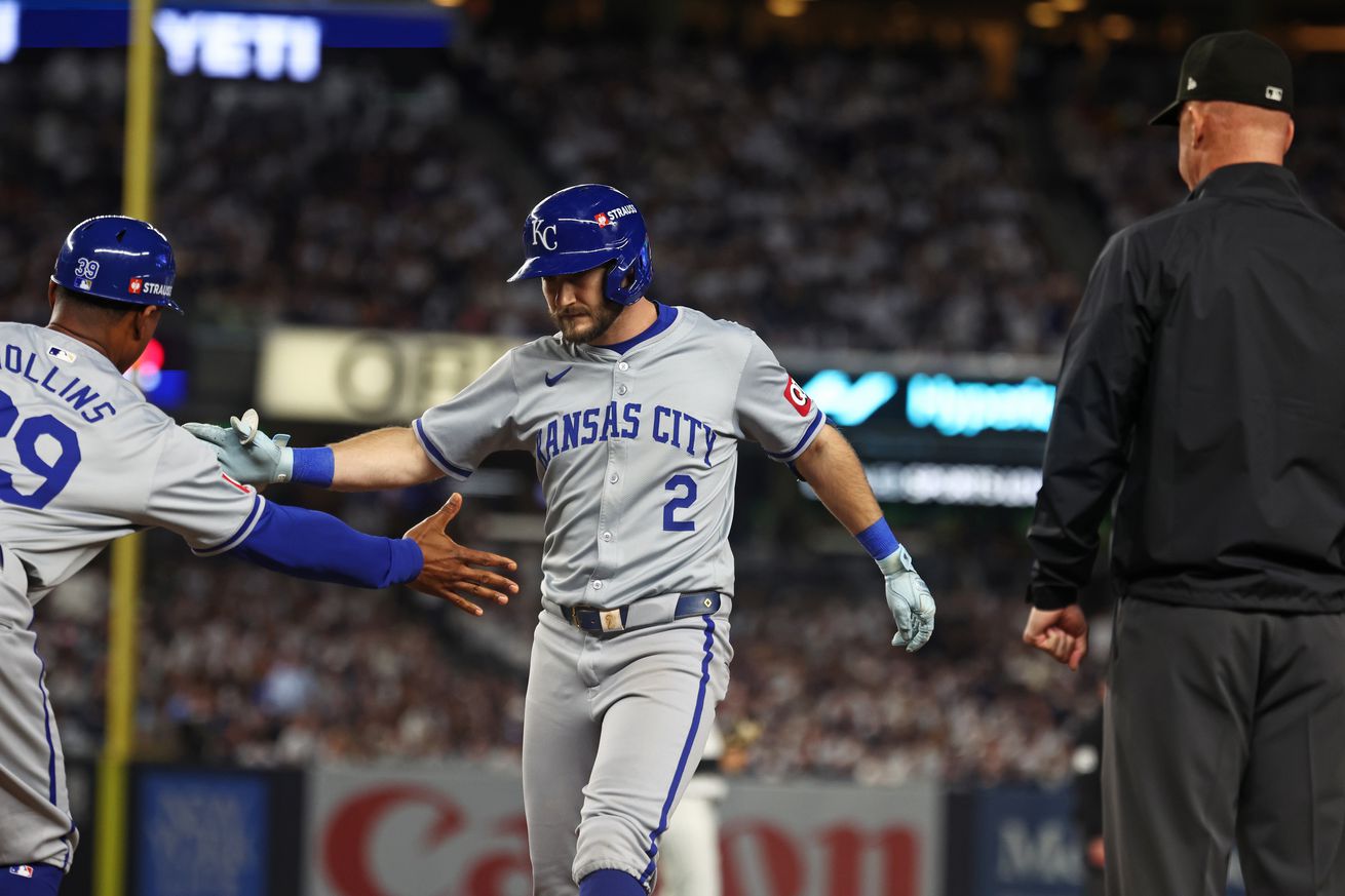 Kansas City Royals outfielder Garrett Hampson (2) hits an RBI single during the sixth inning against the New York Yankees during game one of the ALDS for the 2024 MLB Playoffs at Yankee Stadium. 