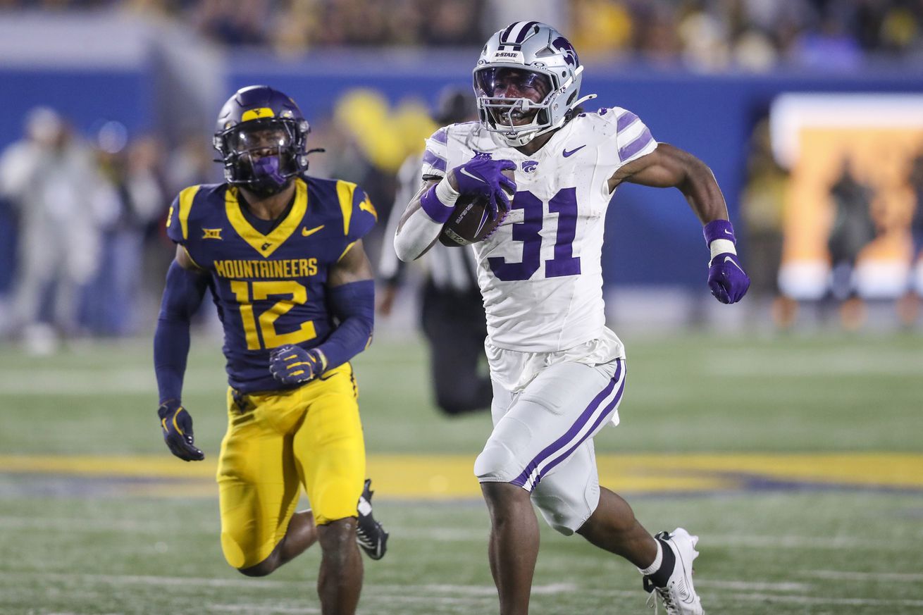 Oct 19, 2024; Morgantown, West Virginia, USA; Kansas State Wildcats running back DJ Giddens (31) runs after a catch during the third quarter against the West Virginia Mountaineers at Mountaineer Field at Milan Puskar Stadium.