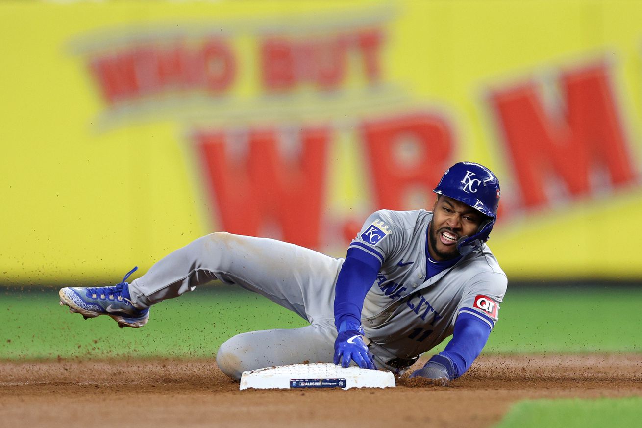 Maikel Garcia #11 of the Kansas City Royals steals second base in the seventh inning against the New York Yankees during Game Two of the Division Series at Yankee Stadium