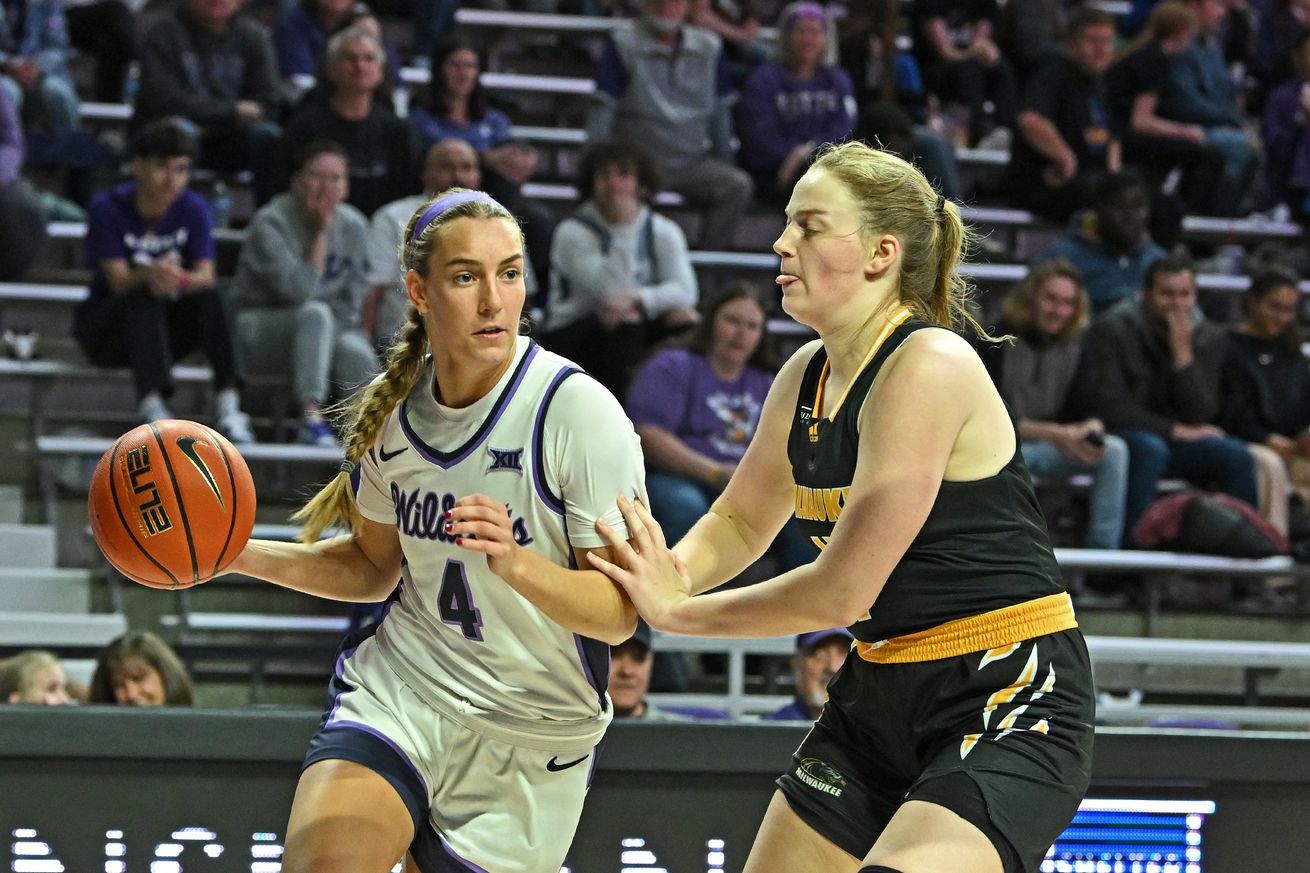 Serena Sundell #4 of the Kansas State Wildcats drives with the ball against Anna Lutz #4 of the Milwaukee Panthers in the second half at Bramlage Coliseum on November 20, 2024 in Manhattan, Kansas.