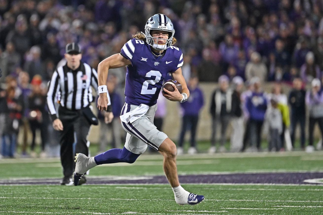 Quarterback Avery Johnson #2 of the Kansas State Wildcats runs to the outside against the Cincinnati Bearcats in the first half at Bill Snyder Family Football Stadium on November 23, 2024 in Manhattan, Kansas.