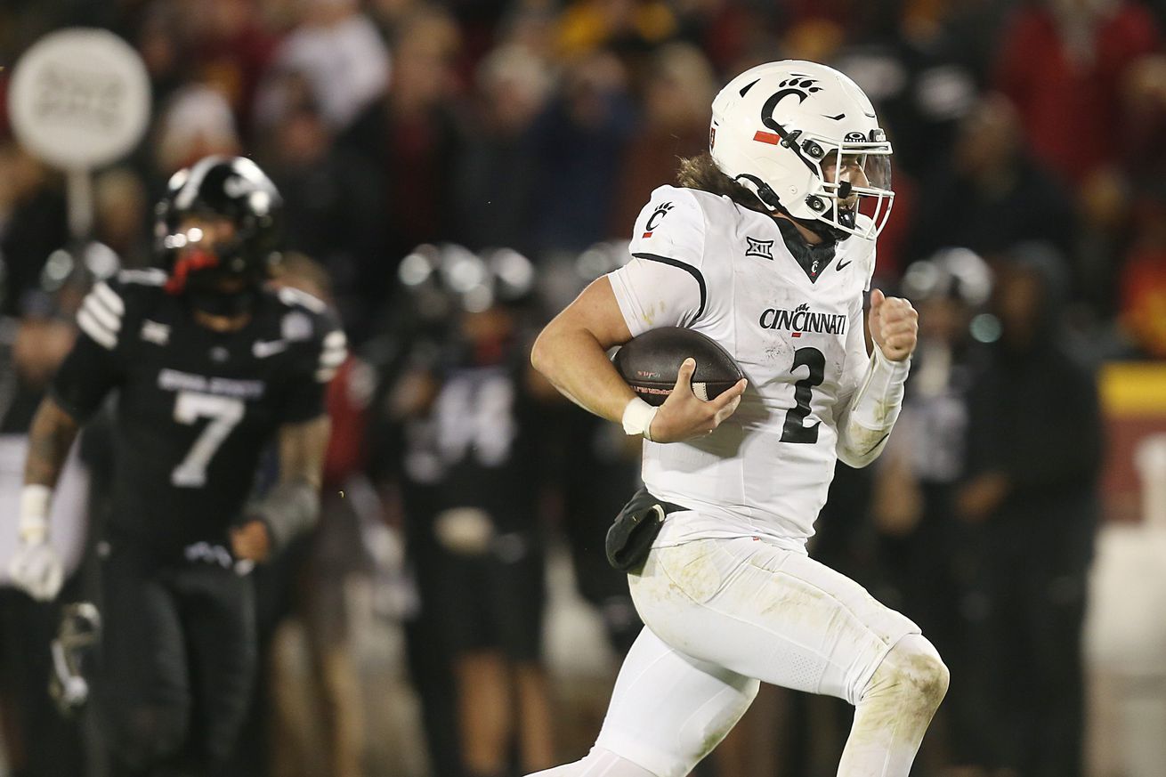 Cincinnati Bearcats’ quarterback Brendan Sorsby (2) runs for a touchdown against Iowa State during the fourth quarter in the week-12 NCAA football at Jack Trice Stadium on Saturday, Nov. 16, 2024, in Ames, Iowa.