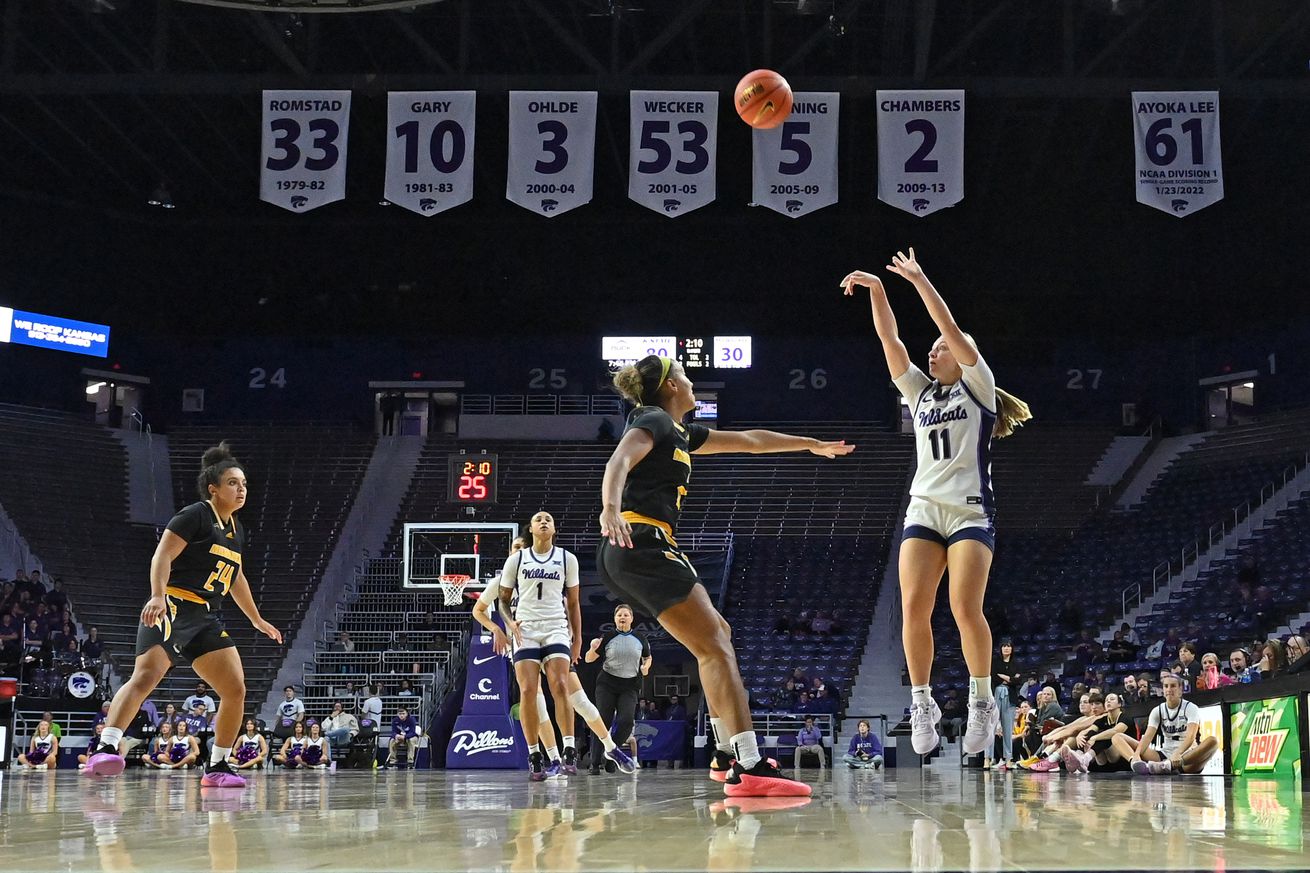 Taryn Sides #11 of the Kansas State Wildcats puts up a three-point shot against Kallie Peppler #22 of the Milwaukee Panthers in the second half at Bramlage Coliseum on November 20, 2024 in Manhattan, Kansas.