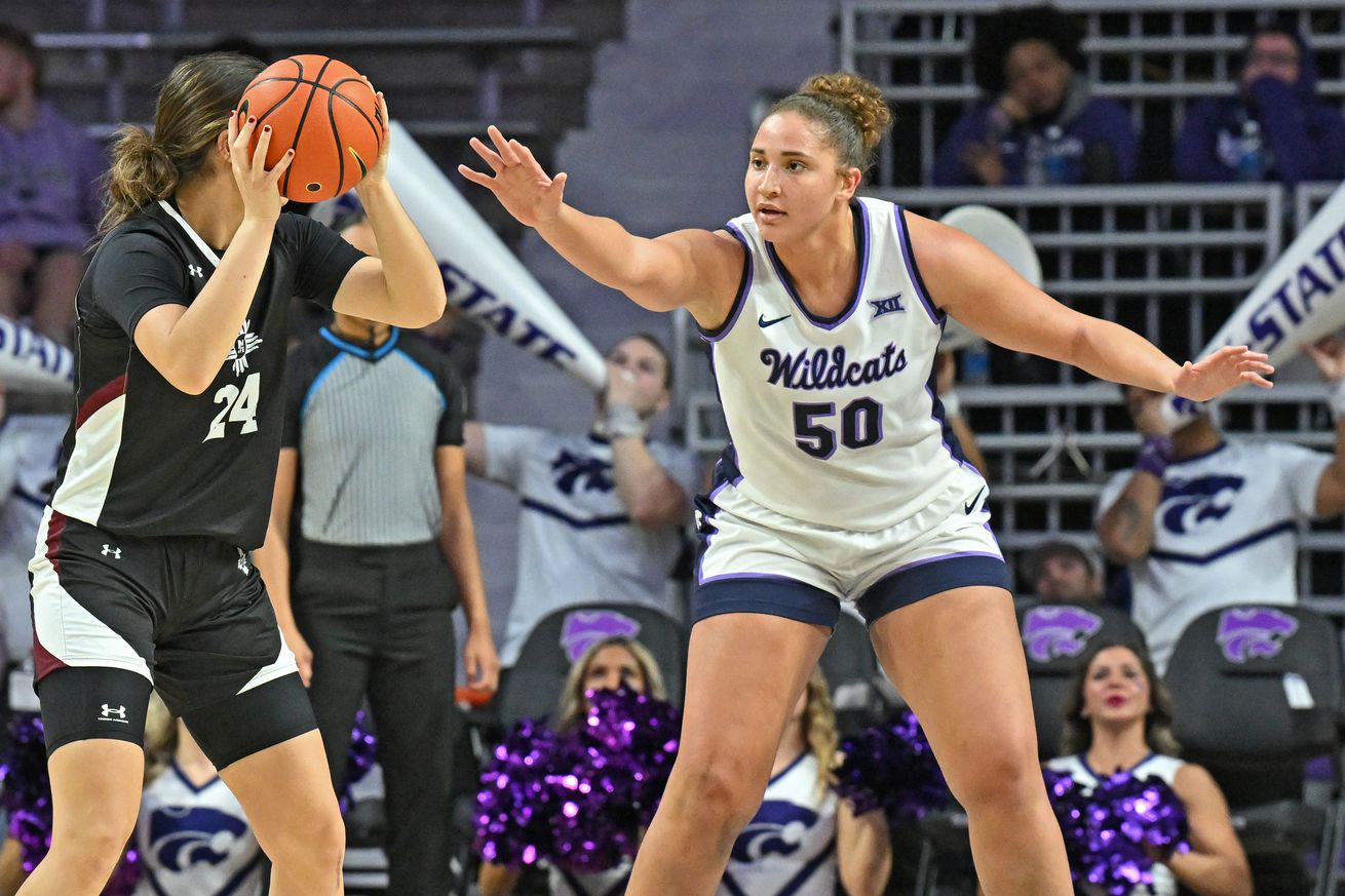 Ayoka Lee #50 of the Kansas State Wildcats defends Lucia Yenes #24 of the New Mexico State Aggies in the second half at Bramlage Coliseum on December 18, 2024 in Manhattan, Kansas.