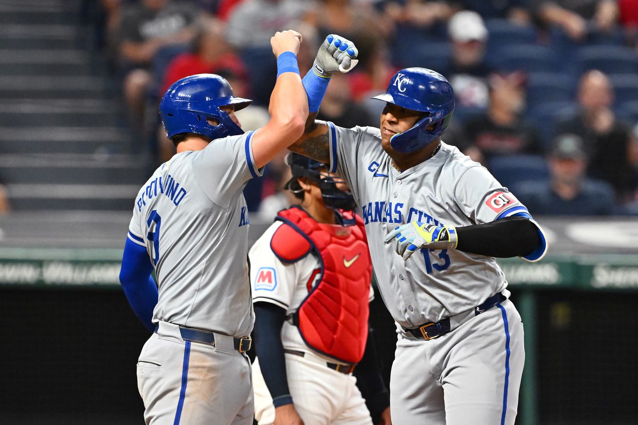 Vinnie Pasquantino #9 celebrates with Salvador Perez #13 of the Kansas City Royals after Perez hit a grand slam during the sixth inning of game two of a doubleheader against the Cleveland Guardians at Progressive Field on August 26, 2024 in Cleveland, Ohio.