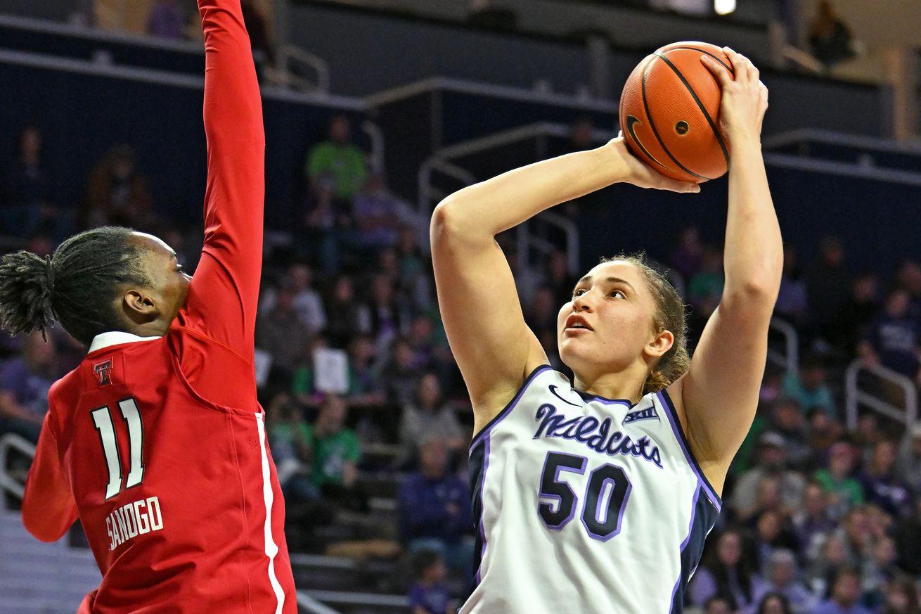 Ayoka Lee #50 of the Kansas State Wildcats shoots the ball against Sarengbe Sanogo #11 of the Texas Tech Red Raiders in the second half at Bramlage Coliseum on January 4, 2025 in Manhattan, Kansas.