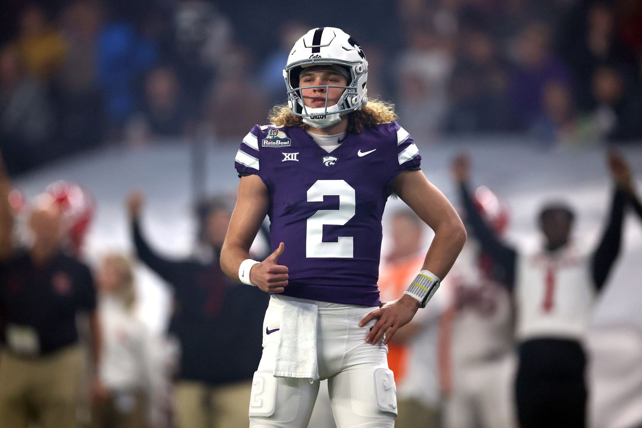 PHOENIX, ARIZONA - DECEMBER 26: Quarterback Avery Johnson #2 of the Kansas State Wildcats gestures during the Rate Bowl against the Rutgers Scarlet Knights at Chase Field on December 26, 2024 in Phoenix, Arizona. The Wildcats defeated the Scarlet Knights 44-41.