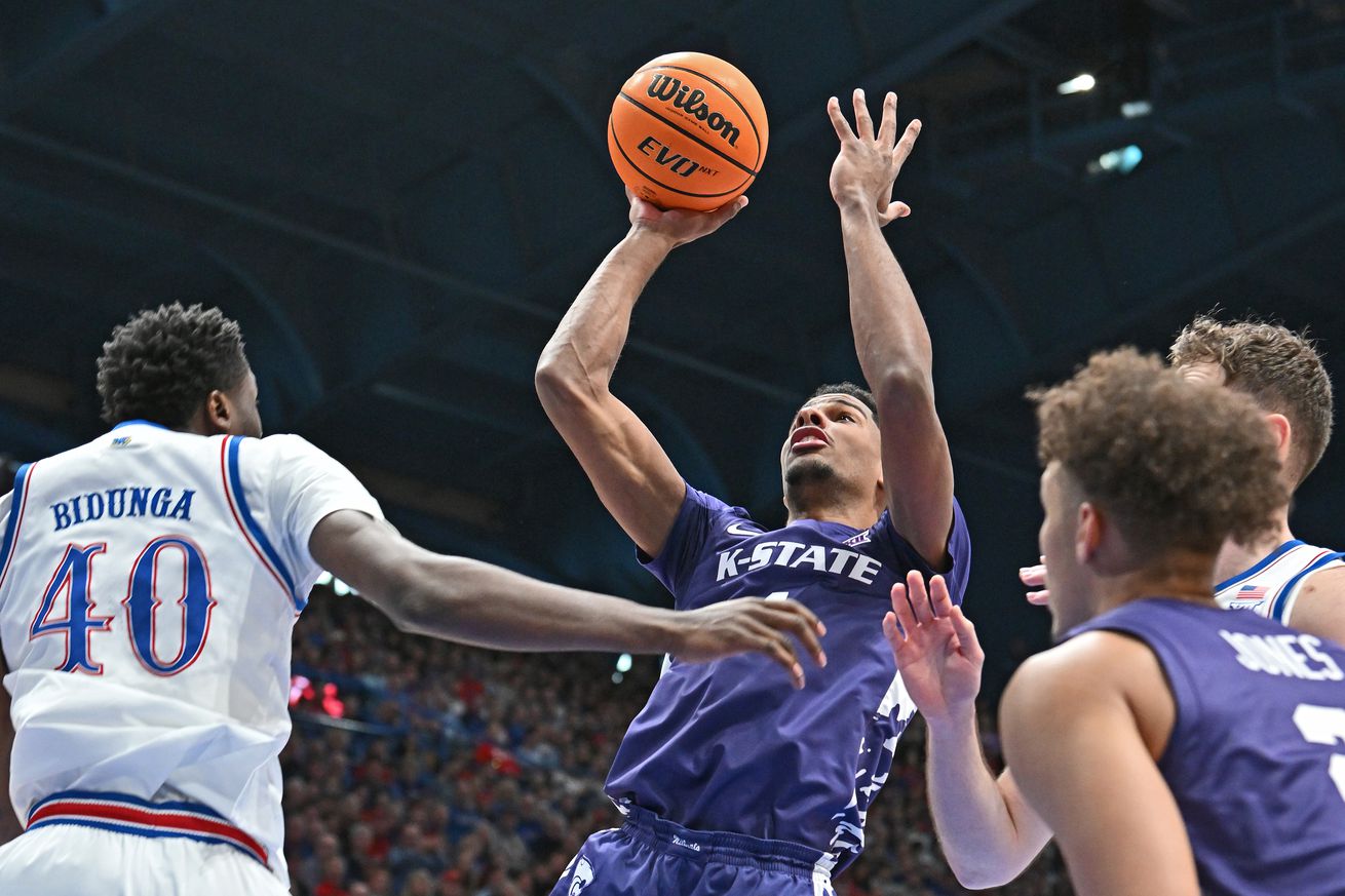 David N’Guessan #1 of the Kansas State Wildcats puts up a shot against Flory Bidunga #40 of the Kansas Jayhawks in the first half at Allen Fieldhouse on January 18, 2025 in Lawrence, Kansas.