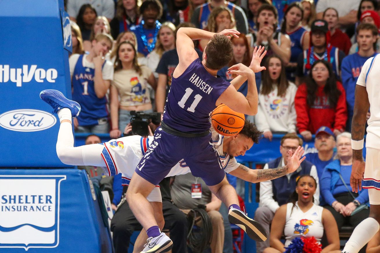 Kansas State Wildcats guard Brendan Hausen (11) is fouled by Kansas Jayhawks guard Zeke Mayo (5) during the second half at Allen Fieldhouse.