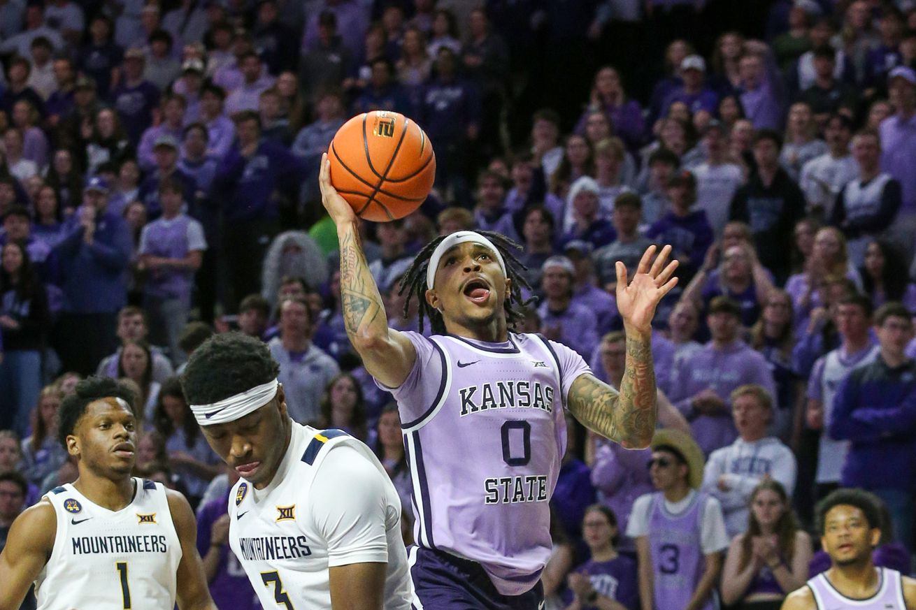 Background: Jan 25, 2025; Manhattan, Kansas, USA; Kansas State Wildcats guard Dug McDaniel (0) goes to the basket against West Virginia Mountaineers guard K.J. Tenner (3) during the first half at Bramlage Coliseum. Mandatory Credit: Scott Sewell-Imagn Images