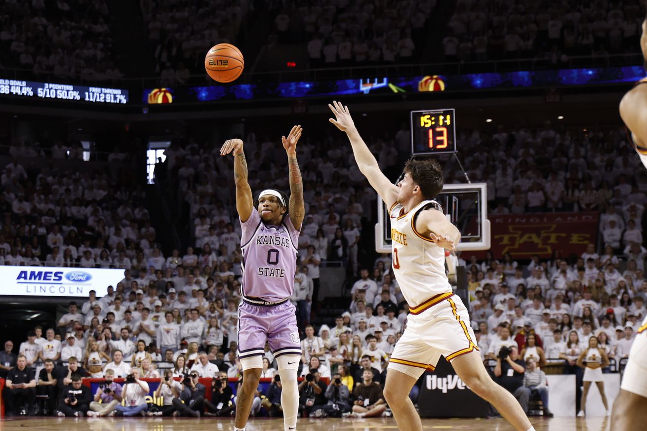 Dug McDaniel #0 of the Kansas State Wildcats takes a three-point shot as Nate Heise #0 of the Iowa State Cyclones tries for the block in the second half of play at Hilton Coliseum on February 1, 2025 in Ames, Iowa. The Kansas State Wildcats won 80-61 over the Iowa State Cyclones.