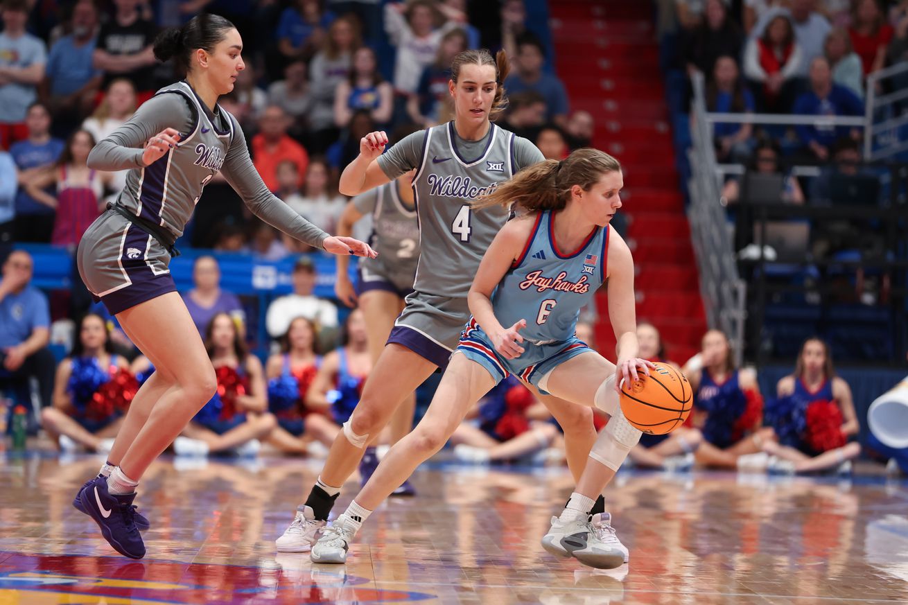 Kansas Jayhawks guard Laia Conesa (6) struggles to get away from the pressure of Kansas State Wildcats Jaelyn Glenn (3) and Serena Sundell (4) in the fourth quarter of a Big 12 women’s basketball game between the Kansas State Wildcats and Kansas Jayhawks on February 2, 2025 at Allen Fieldhouse in Lawrence, KS.