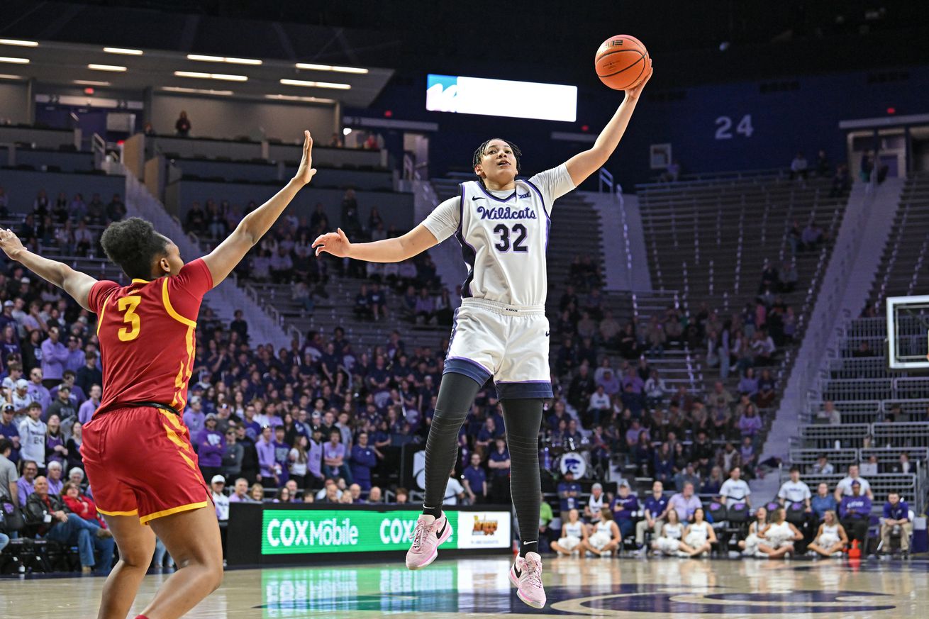 Imani Lester #32 of the Kansas State Wildcats catches a high pass against Alisa Williams #3 of the Iowa State Cyclones in the second half at Bramlage Coliseum on January 30, 2025 in Manhattan, Kansas.