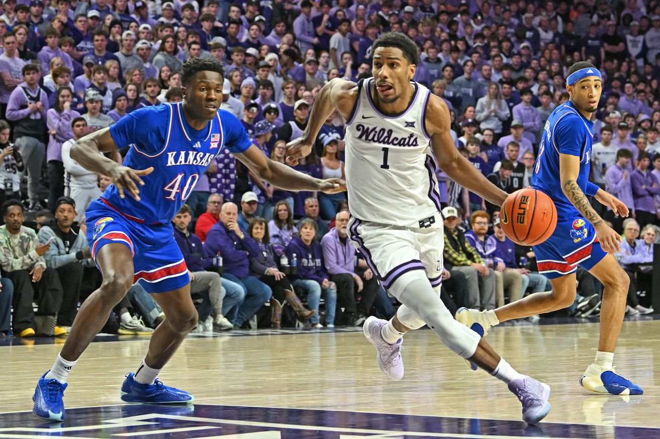 David N’Guessan #1 of the Kansas State Wildcats drive with the ball against Flory Bidunga #40 of the Kansas Jayhawks in the second half at Bramlage Coliseum on February 8, 2025 in Manhattan, Kansas.