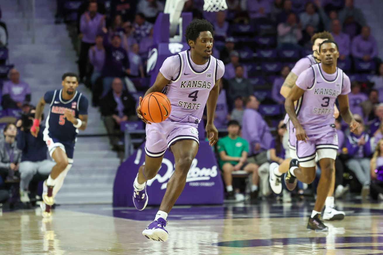 Feb 11, 2025; Manhattan, Kansas, USA; Kansas State Wildcats guard Mobi Ikegwuruka (4) brings the ball up court during the first half against the Arizona Wildcats at Bramlage Coliseum.