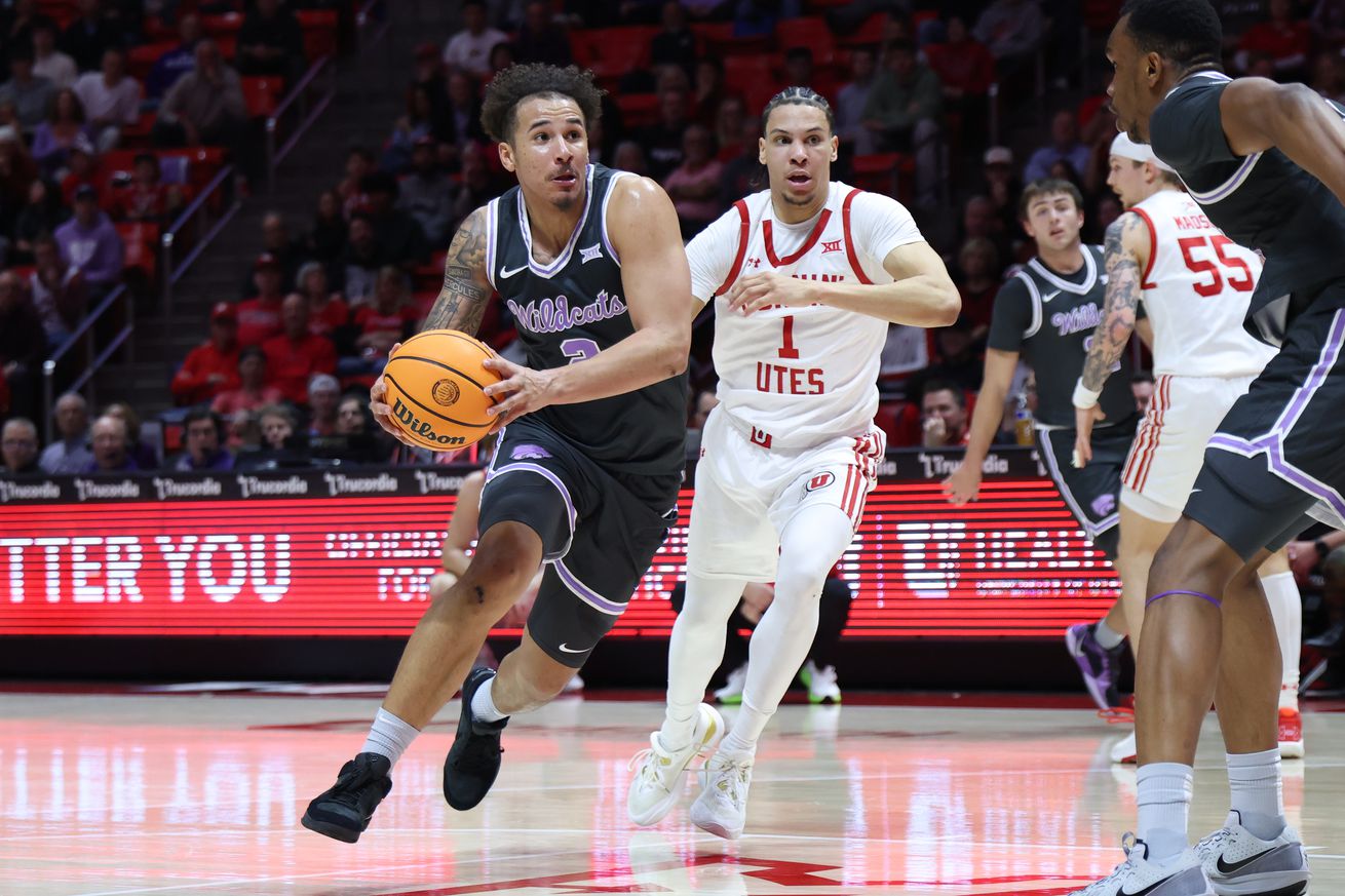 Feb 17, 2025; Salt Lake City, Utah, USA; Kansas State Wildcats guard Max Jones (2) drives against Utah Utes guard Miro Little (1) during the first half at Jon M. Huntsman Center. Mandatory Credit: Rob Gray-Imagn Images