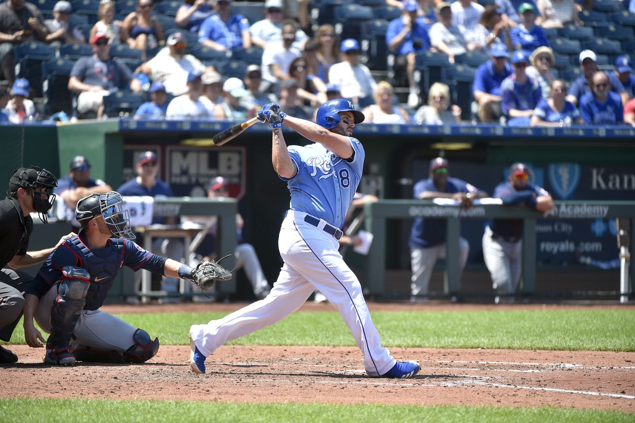 Mike Moustakas #8 of the Kansas City Royals follows through on a swing