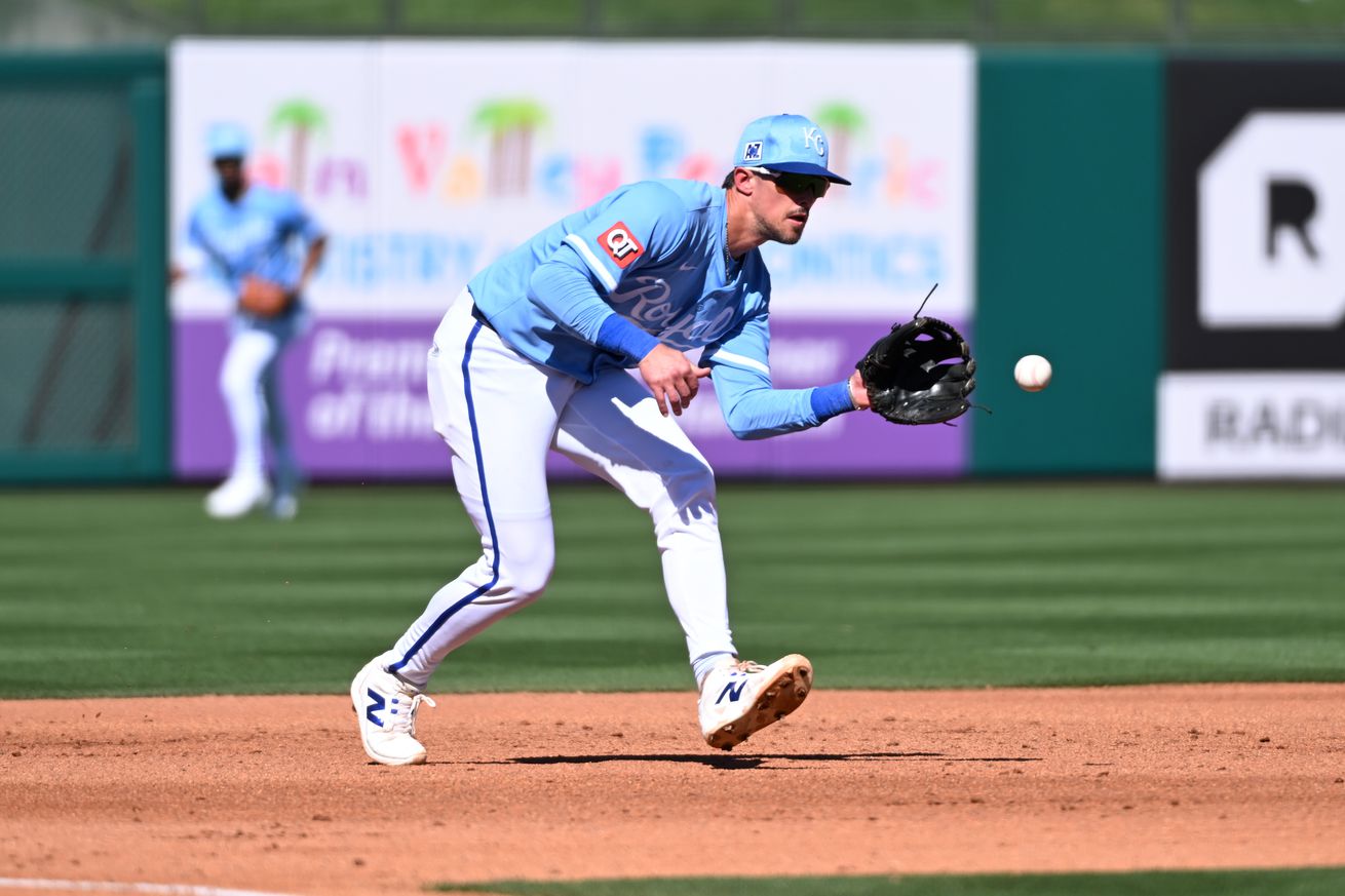 Cavan Biggio #18 of the Kansas City Royals makes a play against the Colorado Rockies during a spring training game at Surprise Stadium on February 26, 2025 in Surprise, Arizona.