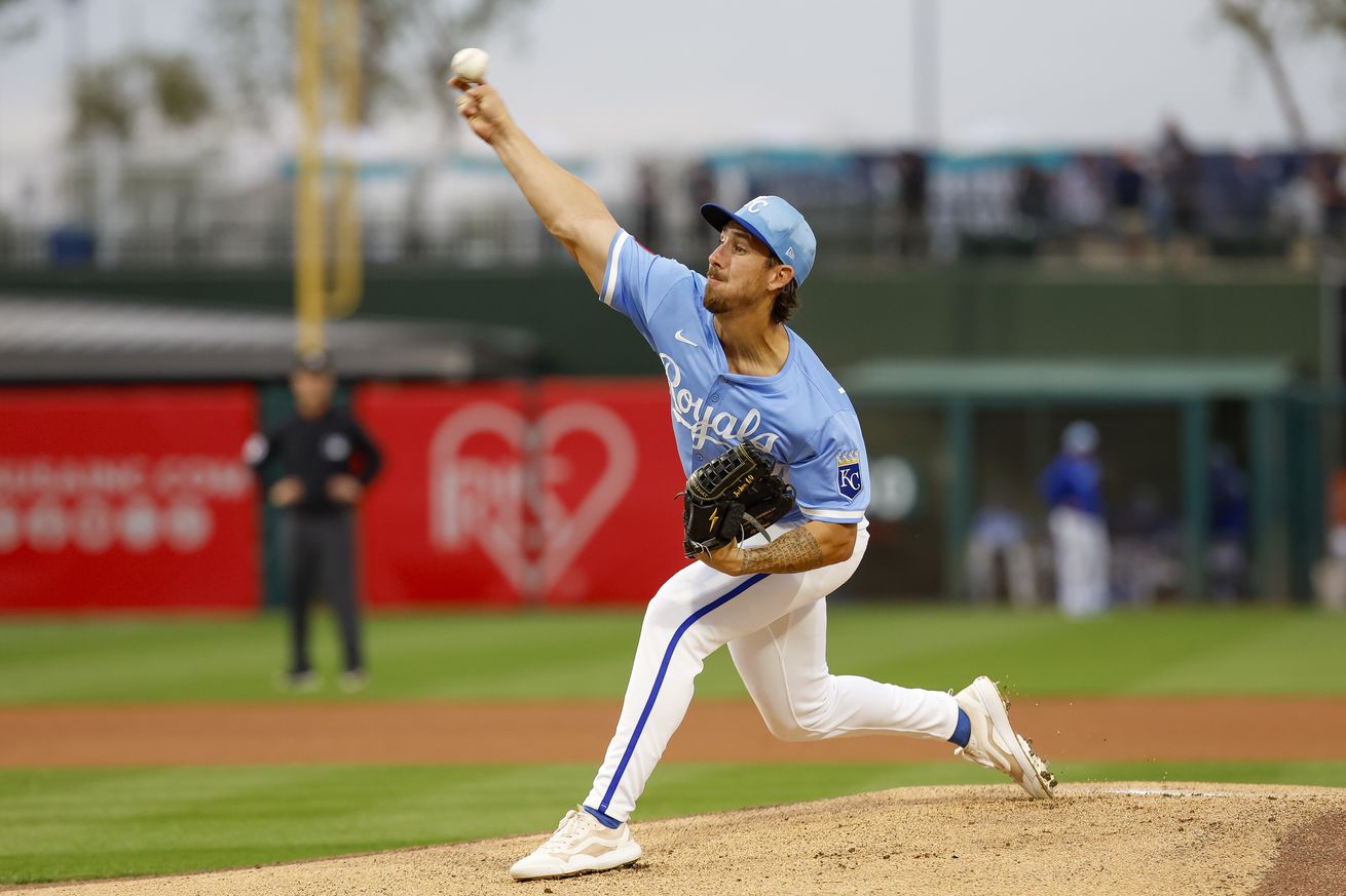 Michael Lorenzen #24 of the Kansas City Royals throws a warm up pitch in the first inning during a spring training game against the Seattle Mariners at Surprise Stadium on March 5, 2025 in Surprise, Arizona.